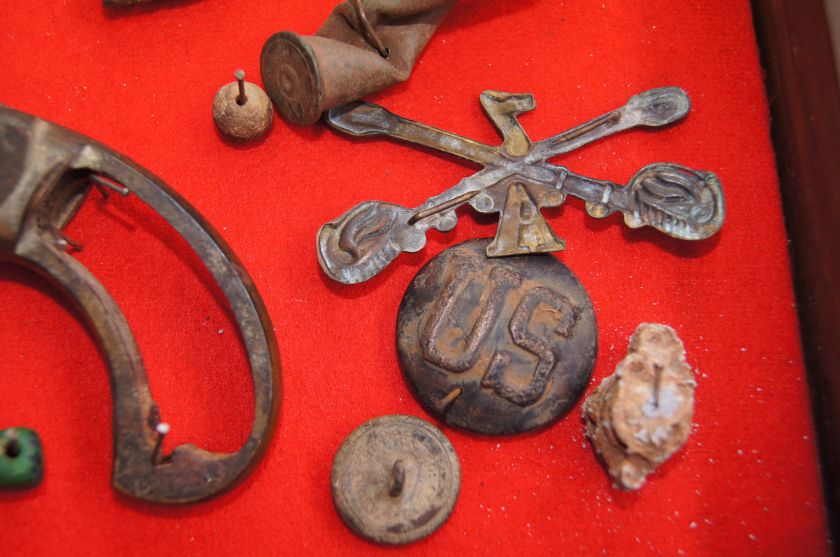 Shadowbox with various relics/artifacts found at the WASHITA 