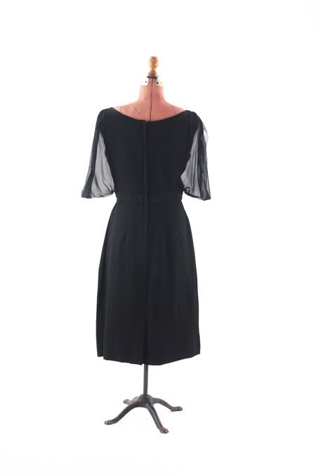 Beautiful late 1950s black cocktail dress. Dress is fully lined, the 